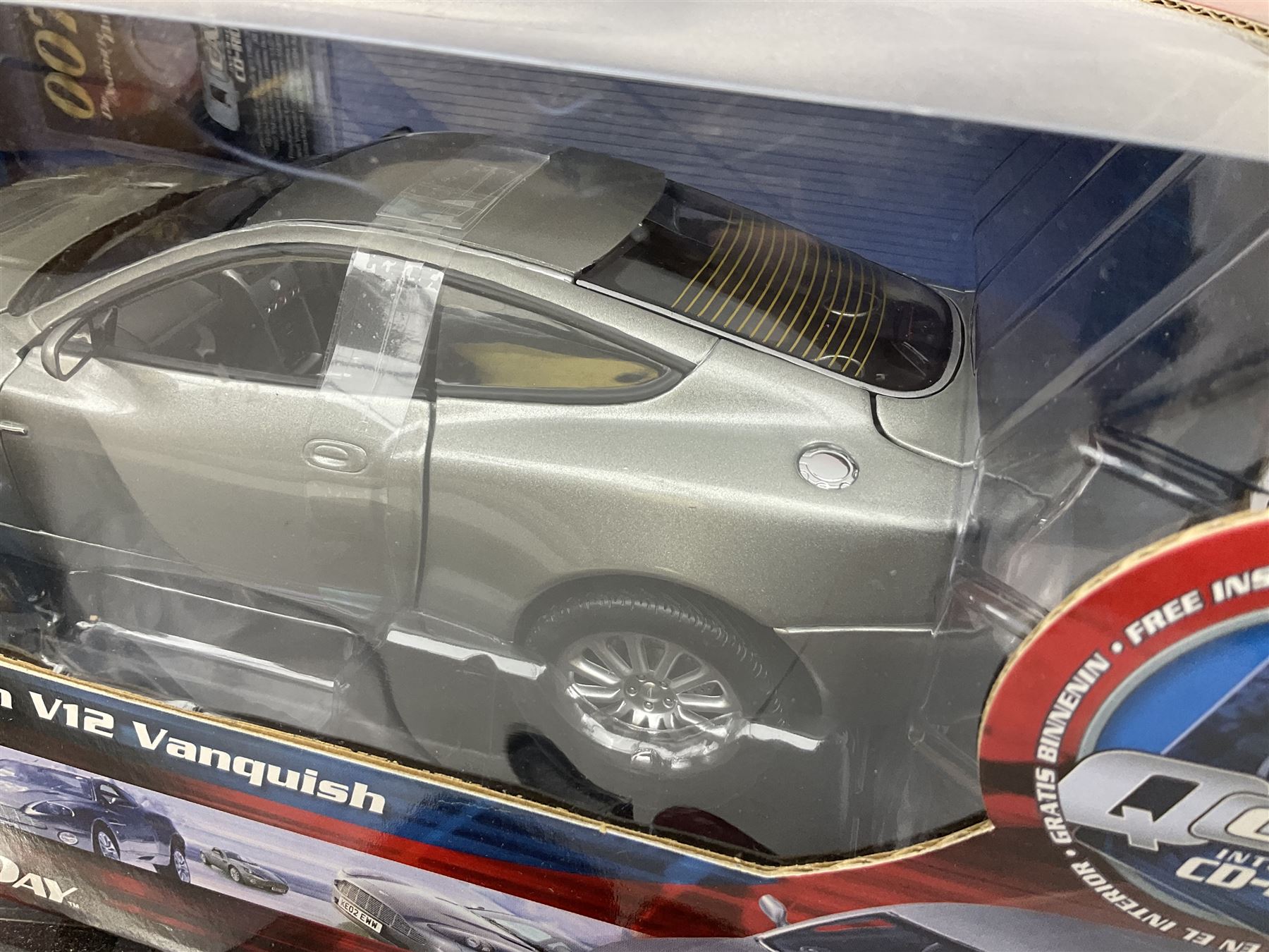 RCERTL Joyride James Bond 1:18th scale die-cast model cars - Lotus Esprit (silvered) from The Spy Who Loved Me, Aston Martin V12 Vanquish from Die Another Day and Chevrolet Corvette from A View To A Kill, all boxed (3)