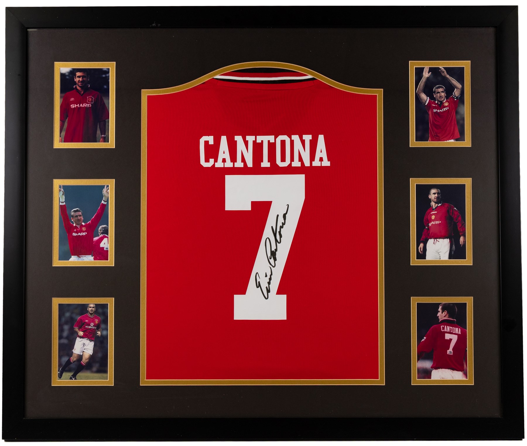 Signed Eric Cantona shirt, framed within a montage of iconic photographs from his Manchester United career, the shirt signed in black marker to the number, with certificate of authenticity from Fisher Promotions, frame H83cm