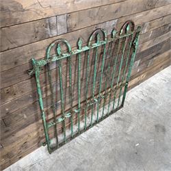 19th century French cast iron garden gate, finished in green rustic paint, bar form with hoop and spear top, with loop hinge brackets