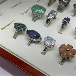 Forty silver stone-set rings including topaz, amethyst, tanzanite etc, all tested and stamped 925, housed in a presentation ring box