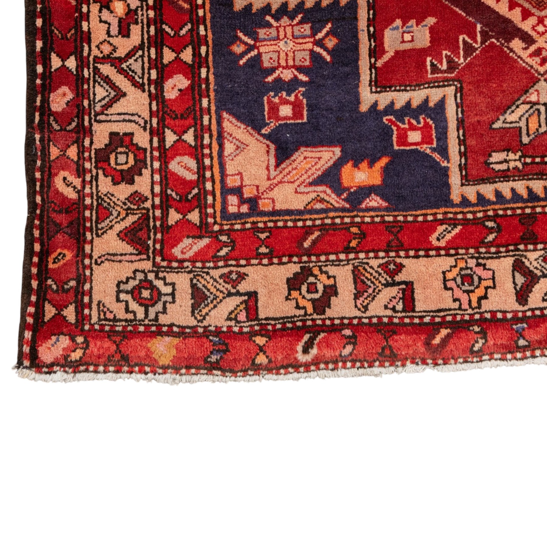 North West Persian runner, the indigo field decorated with three stepped cruciform medallions alternating with two octagonal panels, interspersed with stylised flowerheads and foliage, enclosed by an ivory ground floral border and red guard bands