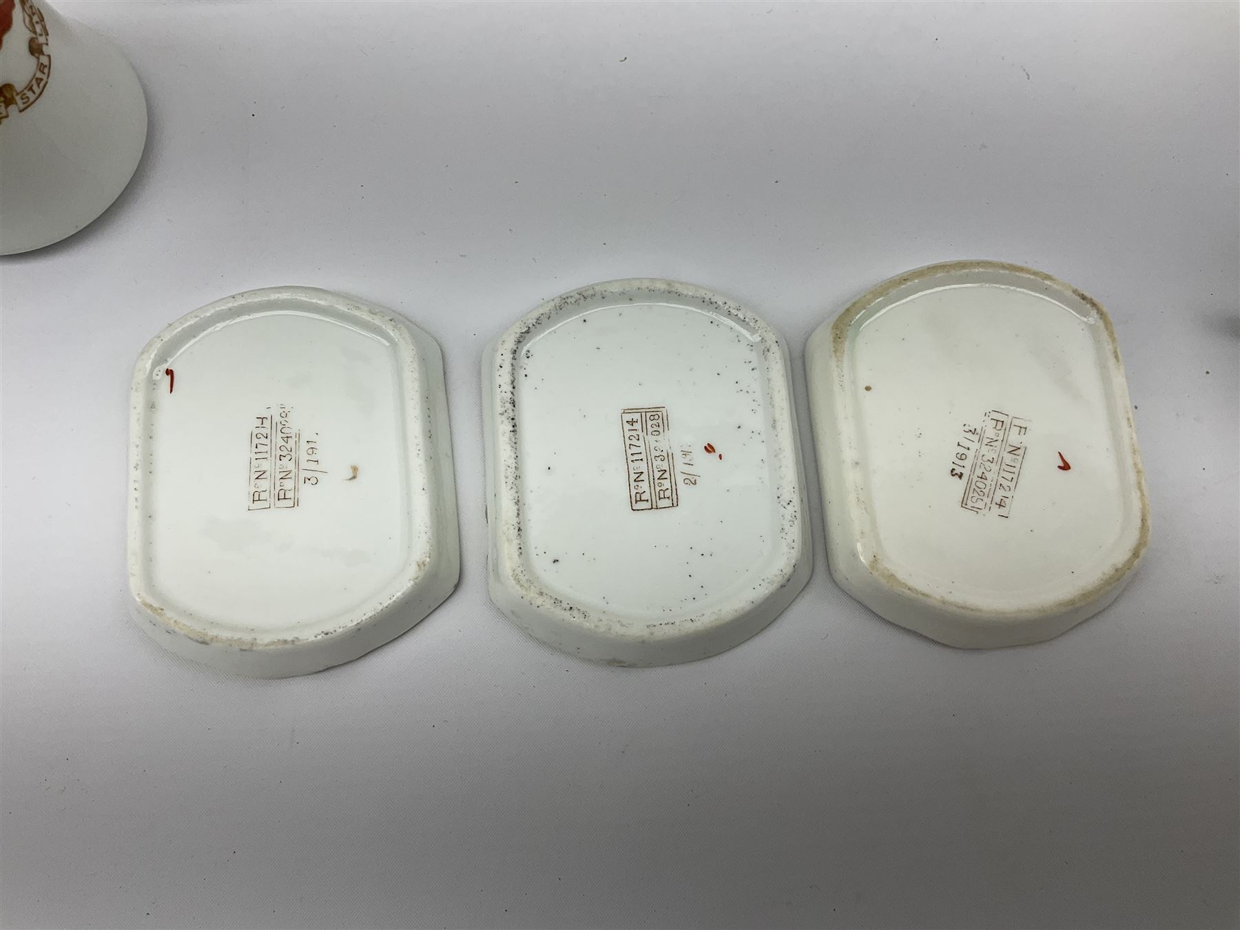 White Star Line, six pieces of porcelain by Stonier & Co. Liverpool, comprising four tea cups, three saucers, jug and three pin trays, registered design no. 117214/324028, printed mark beneath 