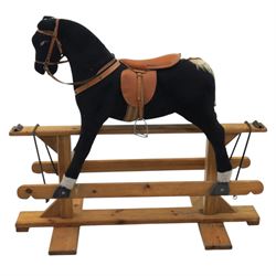 Vintage rocking horse on pine trestle base, early to mid 20th century