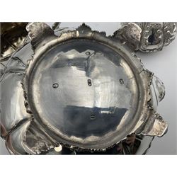 Victorian silver three piece tea service, comprising teapot, twin handled open sucrier, and milk jug, each of bellied form with acanthus capped scroll handles, the sides embossed with alternating scroll edged vacant panels and panels containing a pair of birds, upon four palmette feet, the teapot with ivory insulators to handle, and bird finial to the hinged domed cover, hallmarked William Hunter & Son, London 1861, teapot H19cm, including handles sucrier H13.5cm, including handle milk jug H12cm

This item has been registered for sale under Section 10 of the APHA Ivory Act