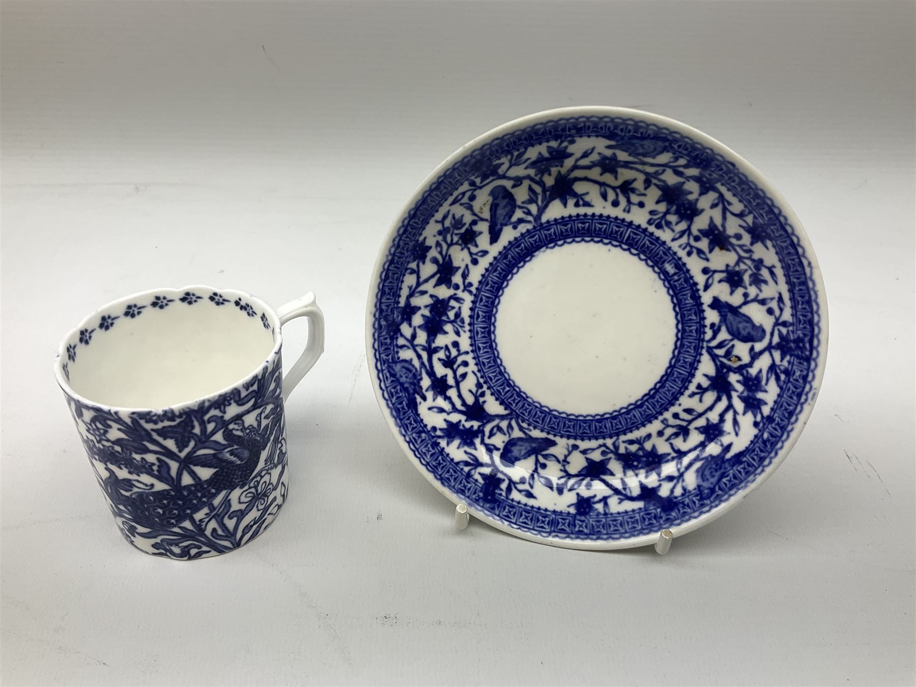 Late 19th Century pot lid bearing ‘The Residence of Anne Hathaway, Shakespeare’s Wife’ below printed decoration of thatched houses and animals scene, Royal Crown Derby Chinoiserie pattern coffee can and saucer, Rd No 758225, and an oval trinket box with gilt decoration bearing interlaced L mark to base (4)