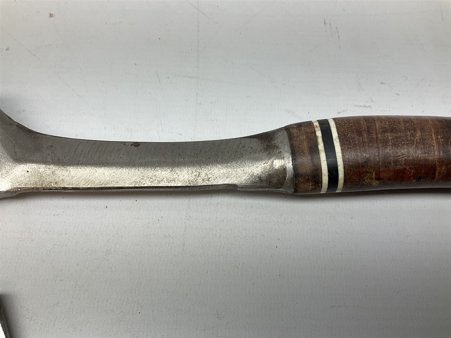 Estwing Black Eagle style double bit throwing axe with leather grip, virtually mint with labels present, plastic blade protectors and nylon sheath L43cm; another smaller Estwing axe stamped 24A to the pommel, with leather grip and sheath; and a vintage short handled hedge knife, the blade stamped IH (?) No.2 (3)