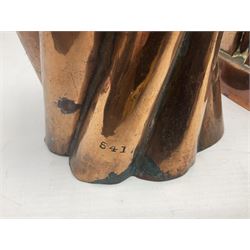 Four Victorian copper moulds, together with a graduating set of copper pans with wooden handles and finials to covers, largest pan 