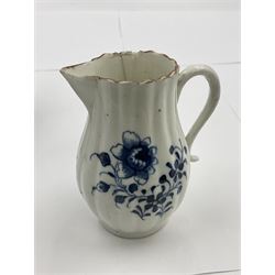 18th century blue and white bell-shaped mug decorated in the rock and peony pattern, probably Bow, H13cm, together with an 18th century Chaughley reeded milk jug decorated in the Gillyflower pattern, H9cm