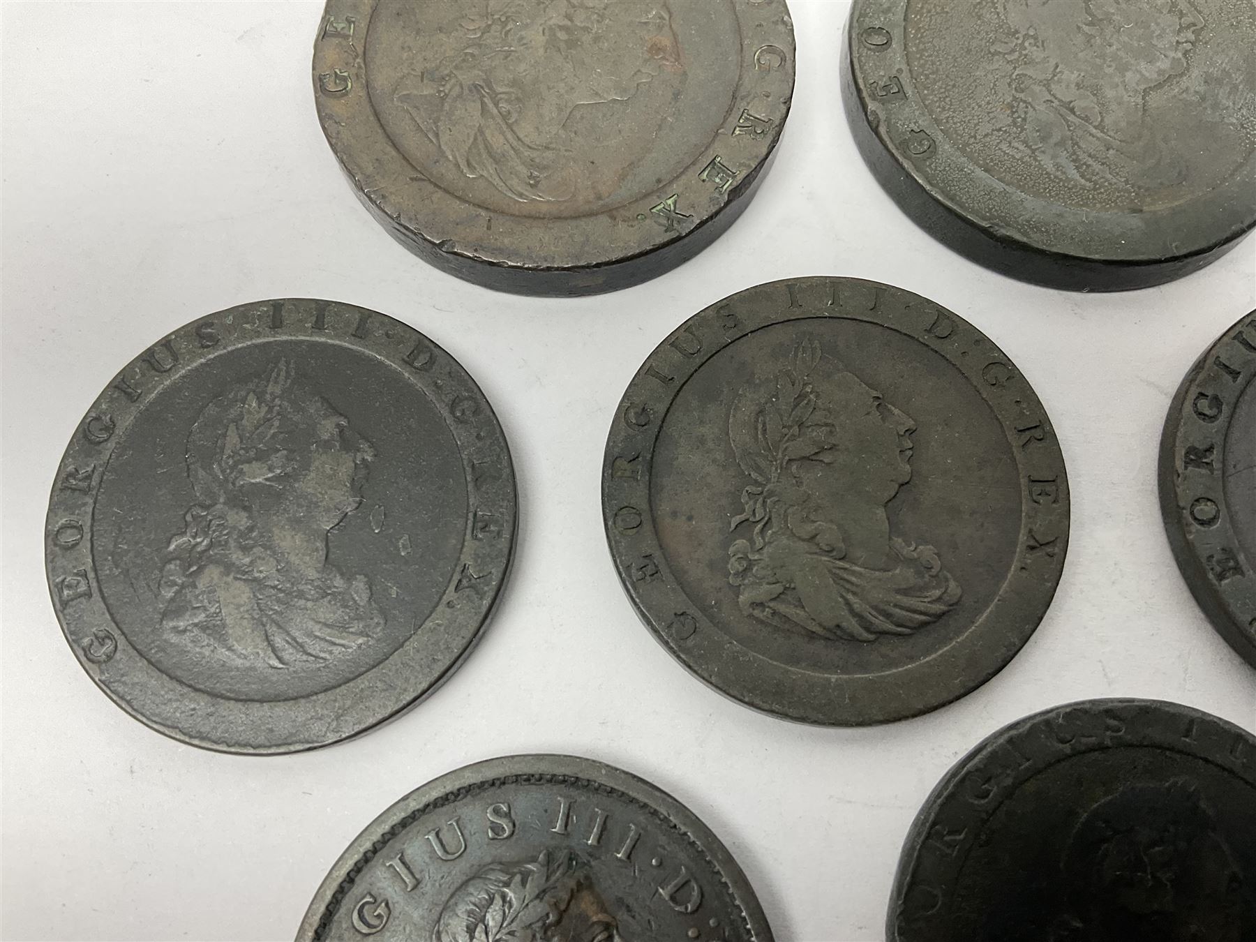 Two George III halfpenny coins dated 1799 and 1806, four pennies dated three 1806 and 1807, four 1797 cartwheel pennies and three 1797 cartwheel two pence coins