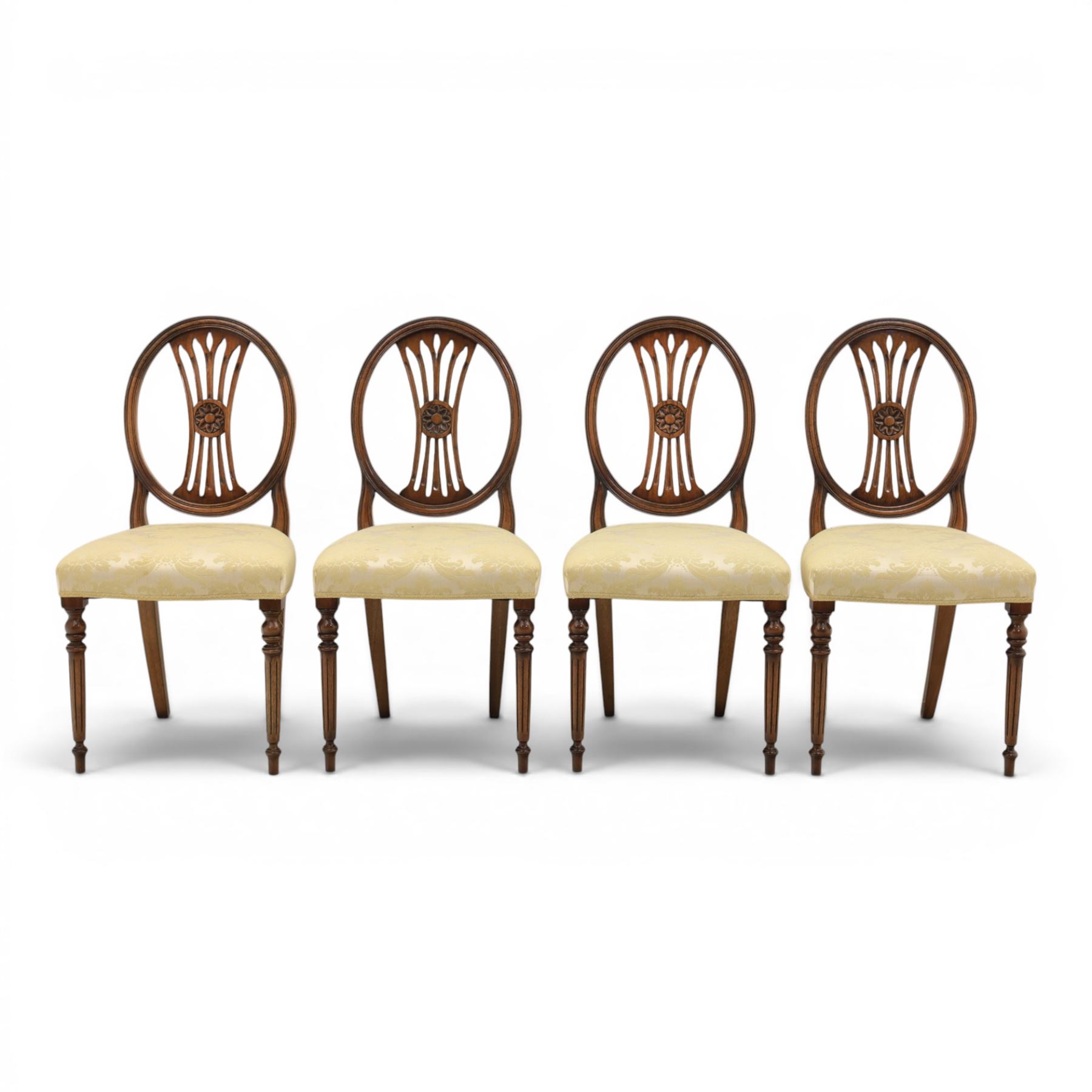 Bevan Funnell Reprodux - Regency design set of ten mahogany dining chairs, oval backs with central splat with rose motif, serpentine seat upholstered in damask fabric, raised on turned supports