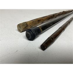 19th century painted bamboo walking cane, the handle carved as a fox with glass eyes, with gilt metal stamped LB, together with an ebonised wooden walking stick, with horn pommel and hallmarked silver collar and a curved wooden walking stick, with monogrammed white metal cap, tallest L90cm