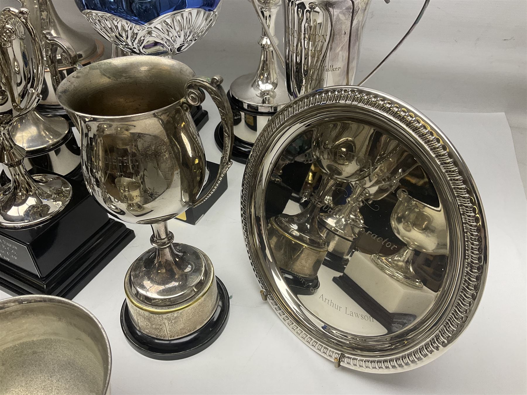 Collection of silver plated and metal trophy cups and winners plaques, all relating to the Burniston and District Show, most engraved with competitions and winner's names, in three boxes 