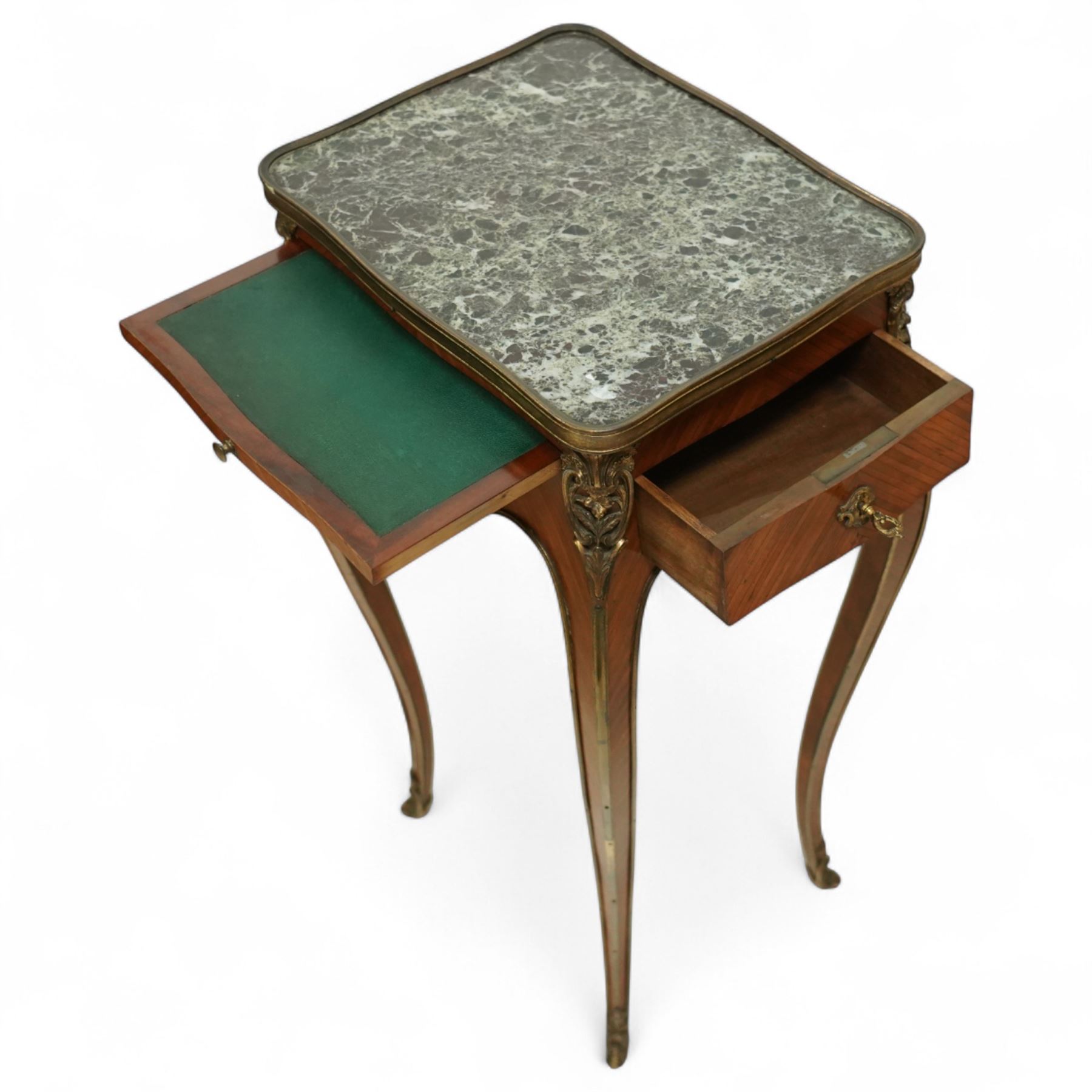 Early 20th century French kingwood and ormolu mounted lamp table, the shaped top inset with green marble above a single locking frieze drawer and pull-out slide, raised on slender cabriole legs with gilt sabots