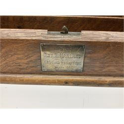 Oak correspondence box, the sloped front opening to reveal a fitted interior with letter rack and calendar, H34cm W39cm. 