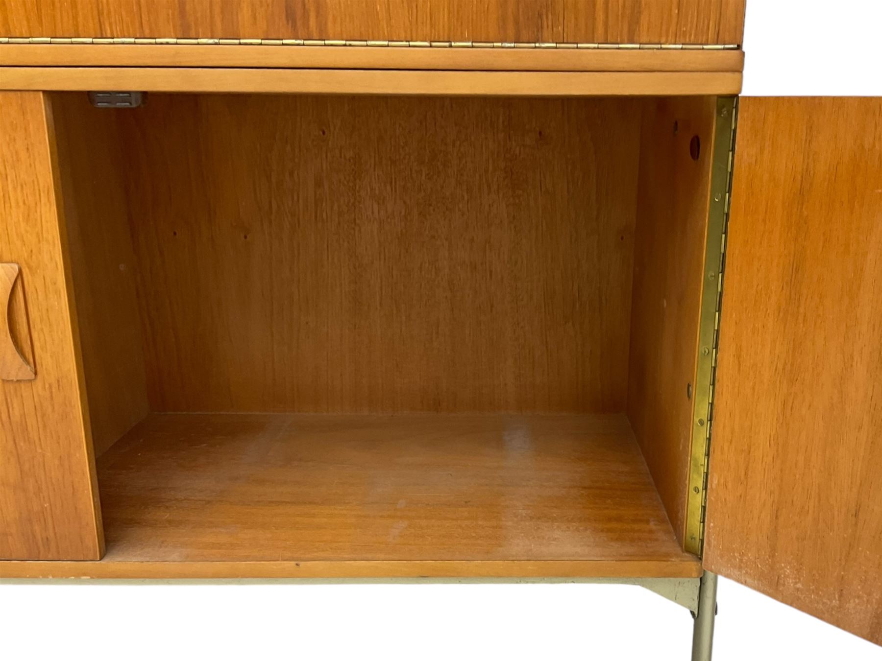 Remploy - mid-20th century teak sectional wall display unit or room divider, raised display cabinet section with sliding glass doors, central fall front section, lower double cupboard section and an additional sliding door section 