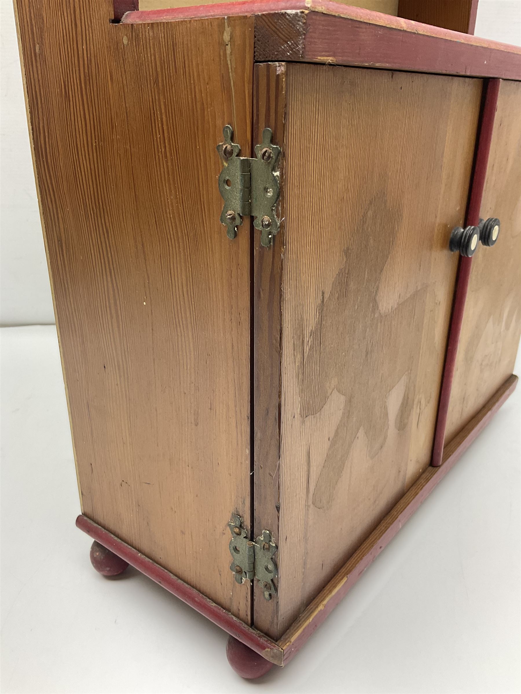 Miniature pitch pine Welsh dresser with open plate rack over two cupboard doors, displayed with Ridgways Humphrey's Clock pattern and other doll's blue/white tea ware, copper kettles and pan etc W41cm H72cm