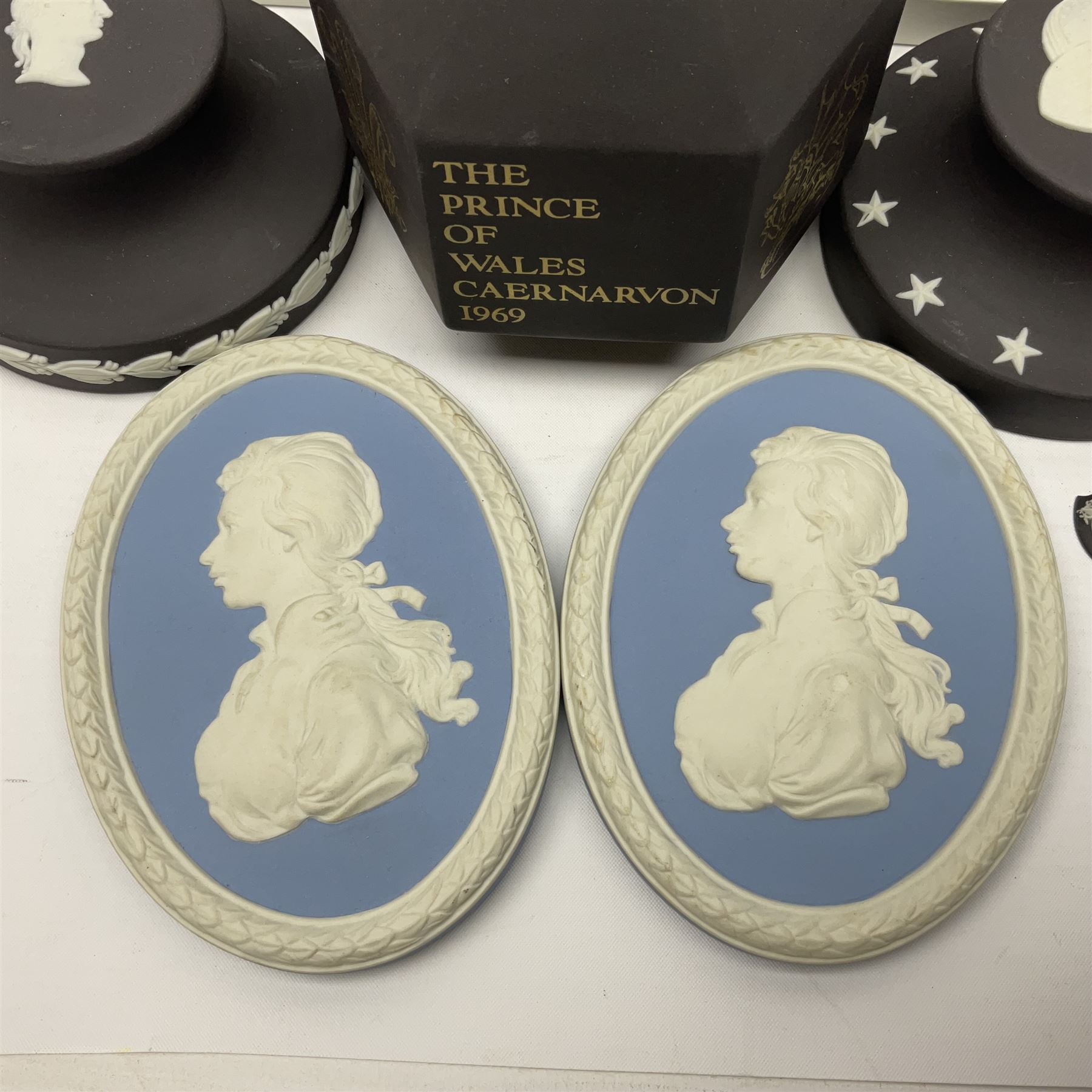 Collection of Wedgwood Jasperware, to include black Eisenhower Bust, two black basalt paperweights, one depicting an eagle and one depicting Julius Caesar, a blue Zodiac plate, Man on the Moon commemorative plate, American Independence Bicentennial plate and Royal commemorative ware, etc, all with impressed marks beneath, some with boxes