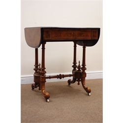  Victorian figured boxwood strung walnut fall leaf writing table, the inset leather slope top with hinged stationary compartment above a frieze drawer, the twin tapering supports with spire finials and turned stretcher on moulded cabriole legs with ceramic castors, W107cm, D57cm, H75cm   