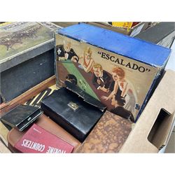 Collection of early 20th century games, to include Escalado (Chad Valley), cased Mahjong, Bezique, the case with hallmarked silver clasp, Autobridge and Kan-U-Go, Waddington's vintage games including Scoop! and Cluedo etc in two boxes