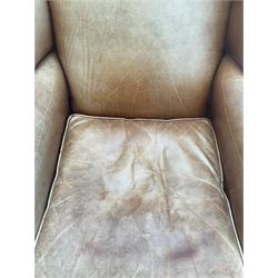 Georgian style wingback armchair, upholstered in tan leather, on cabriole front feet