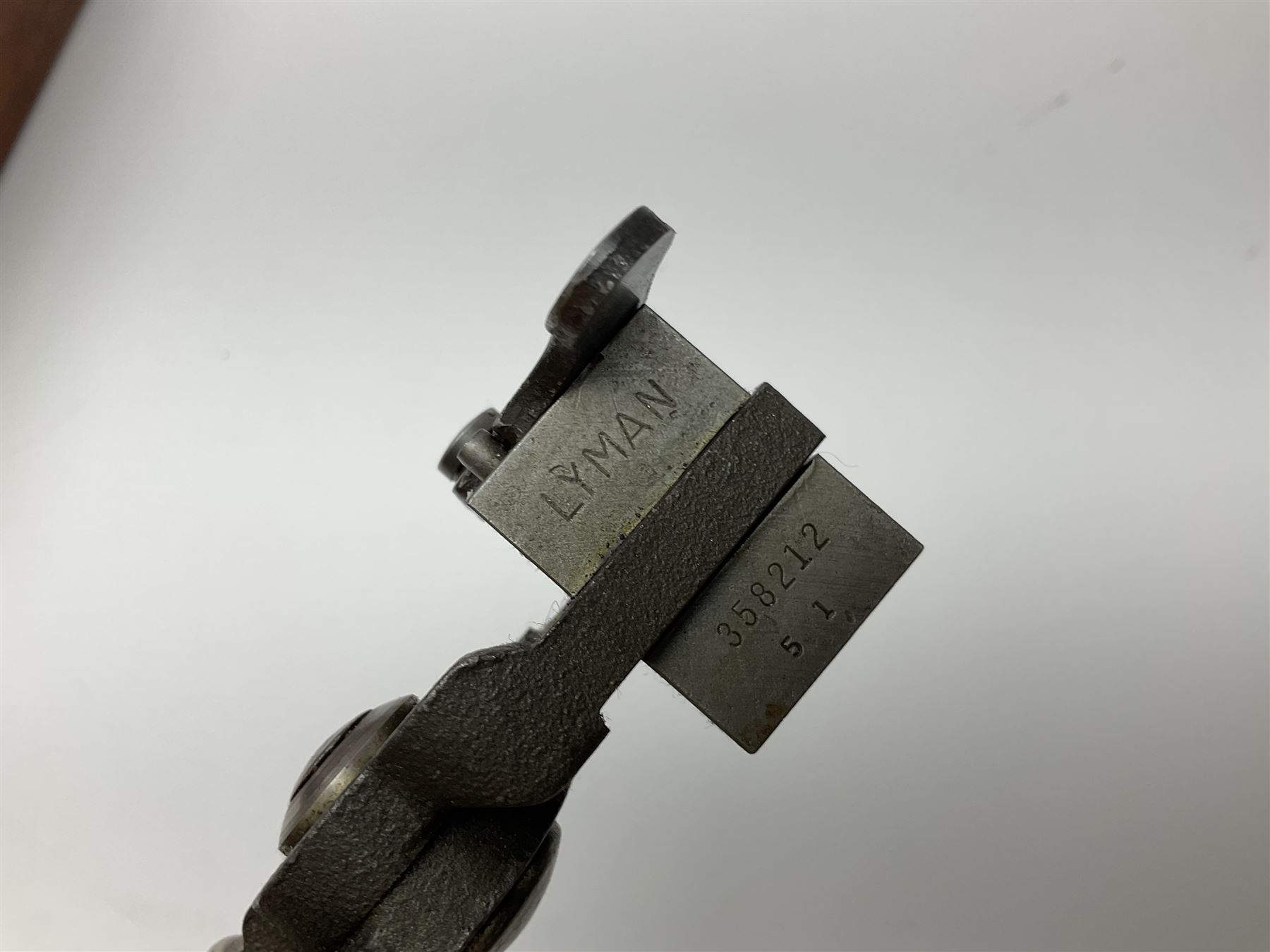 Three modern bullet moulds comprising Lee double cavity .44 calibre, boxed with instructions; and two Lyman .38 calibre; all in unrelated 19th century mahogany box