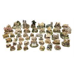 Forty six Lilliput Lane model cottages, to include 'Convent in the Woods', 'Holme Dyke' 'Secret Garden' etc