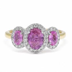 18ct gold pink sapphire and diamond trilogy ring, three oval cut sapphires surrounded by r...