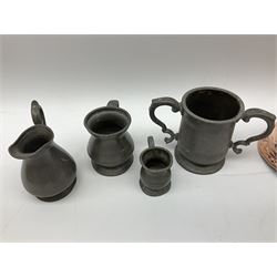Graduated set of four seamed copper harvest measures, pint to half-gill, with lead excise stamps; and four pewter items (8)