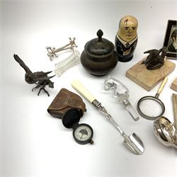 A group of assorted collectables, to include a small bronze model of a pheasant in flight, Georgian silver toddy ladle with inset George II shilling, silver plated stilton scoop with ivory handle, small Victorian sampler, ebony and bone dominoes, etc. 