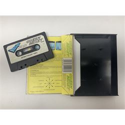 Sinclair ZX Spectrum (1984) with accessories and games; ten games for Sinclair Spectrum and 48K Spectrum to include ‘Knight Lore’, ‘The Way of the Exploding Fist’, and ‘Green Beret’ all in original boxes, ‘Rambo First Blood Part II’ without original box; Sinclair UK1400 Power Supply Unit, Hales Universal Mains Adapter, RAM Turbo Spectrum Joystick Interface, Starlite Cassette Player, all without boxes