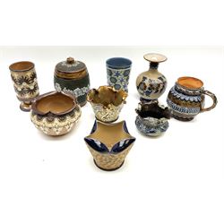 A group of Doulton Lambeth, to include a Slaters Patent tobacco jar and cover, H14cm, beaker with moulded lozenge and flower decoration, H11.5cm, cache pot wit crimped rim, small vase with bulbous body and flared rim, H14cm, etc., all with various impressed and incised marks and makers monograms beneath. 