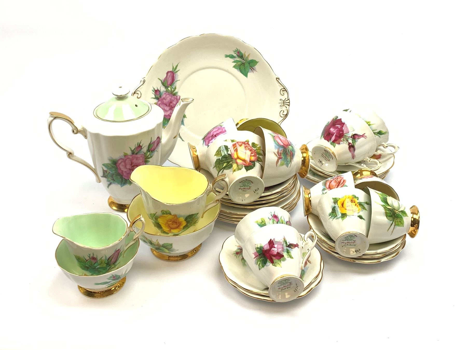 Royal Standard Harry Wheatcroft 'World Famous Roses' tea and coffee wares, comprising teapot, six teacups and six saucers, six coffee cups and five saucers, six side plates, milk jug, cream jug, two open sucriers, and sandwich plate. 