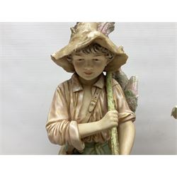 Pair early 20th century Royal Dux porcelain figures, modelled as a young girl carrying a basket of fish, and a young boy carrying game, on naturalistic bases, pink triangle marks, 41cm high (2)