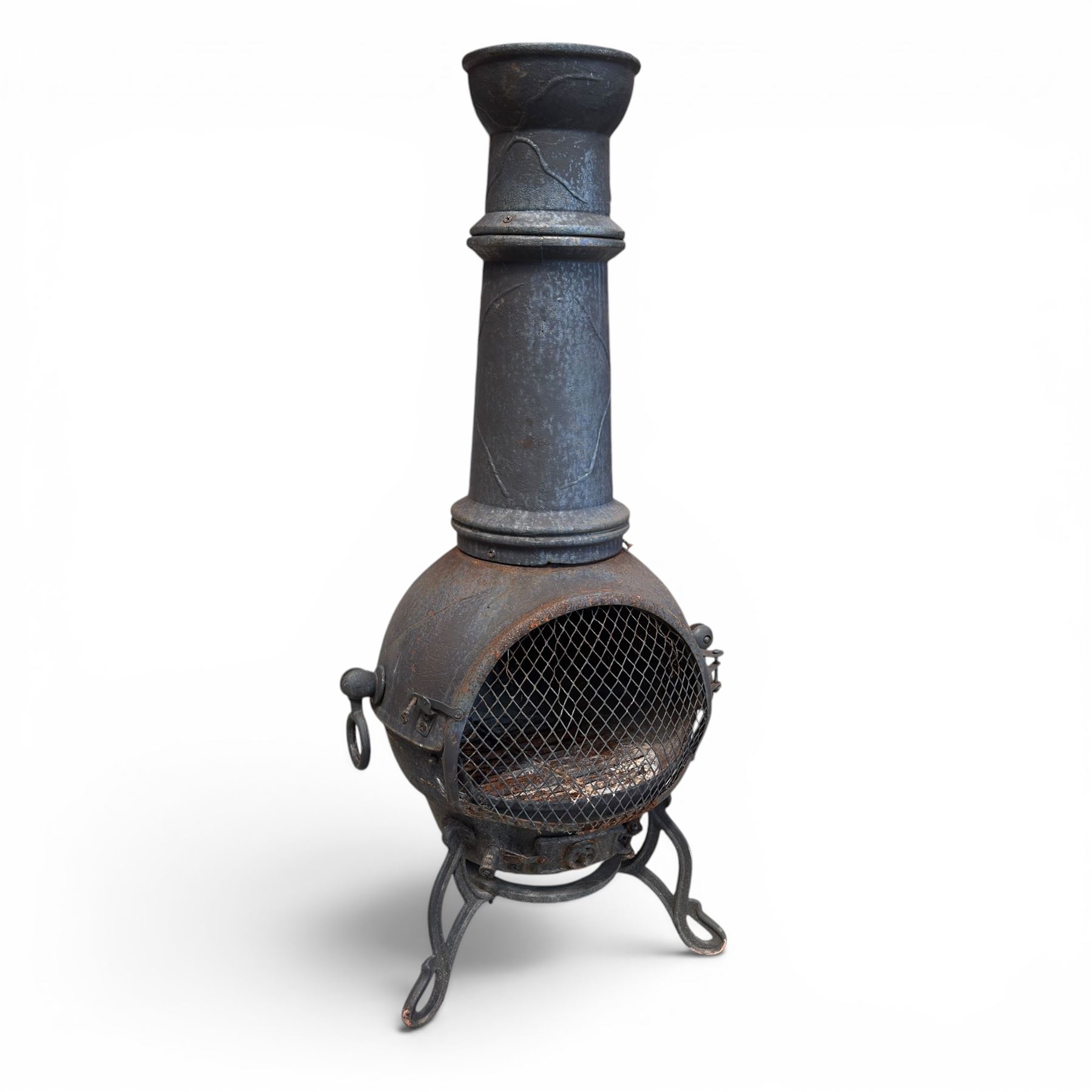 Cast iron garden chiminea, with mesh front spark guard, flue chimney on three splayed legs, finished in black.