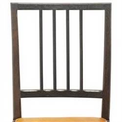 Acornman - set of four dark stained oak dining chairs, with four vertical slats, drop-in tan leather seat, supported on square tapering legs with carved acorn signature, by the workshop of Alan Grainger of Brandsby