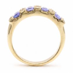 9ct gold tanzanite and diamond half eternity ring, four oval cut tanzanite's, each spaced by three single cut diamonds, hallmarked