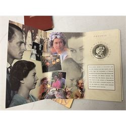 The Royal Mint United Kingdom 1984 brilliant uncirculated coin collection, 1997 and 2001 commemorative crown coins, 1997 old round one pound, all in card folders and four sterling silver medallic first day covers from the 'Great Britons' collection housed in a blue folder