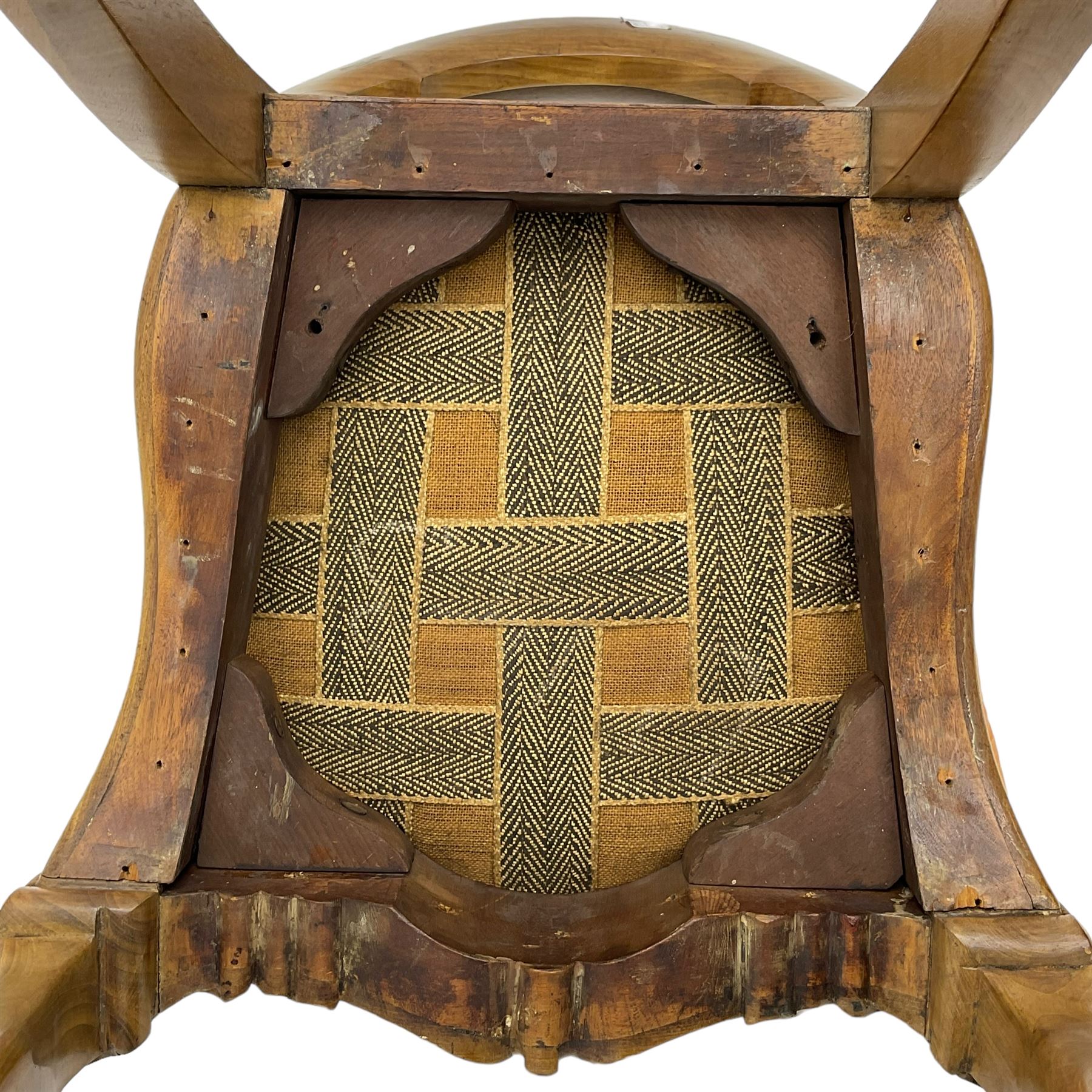 Pair of Victorian walnut side chairs, shaped cresting rail carved with acanthus leaves, overstuffed upholstered seats with stud band, on cabriole supports with scroll carved terminals