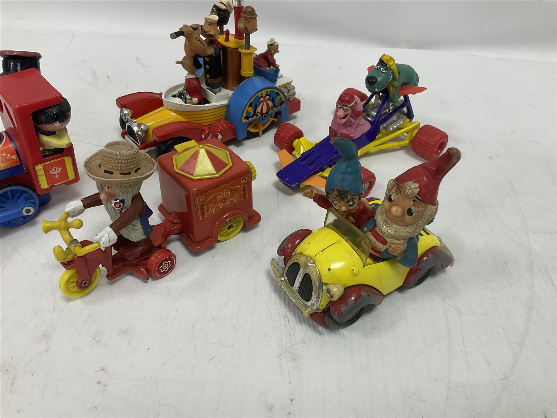 Corgi/Dinky - twelve unboxed and playworn TV/Film related die-cast models including Popeye Paddle Wagon; Dick Dastardly; Magic Roundabout; Muppets; Basil Brush; and Noddy (12)