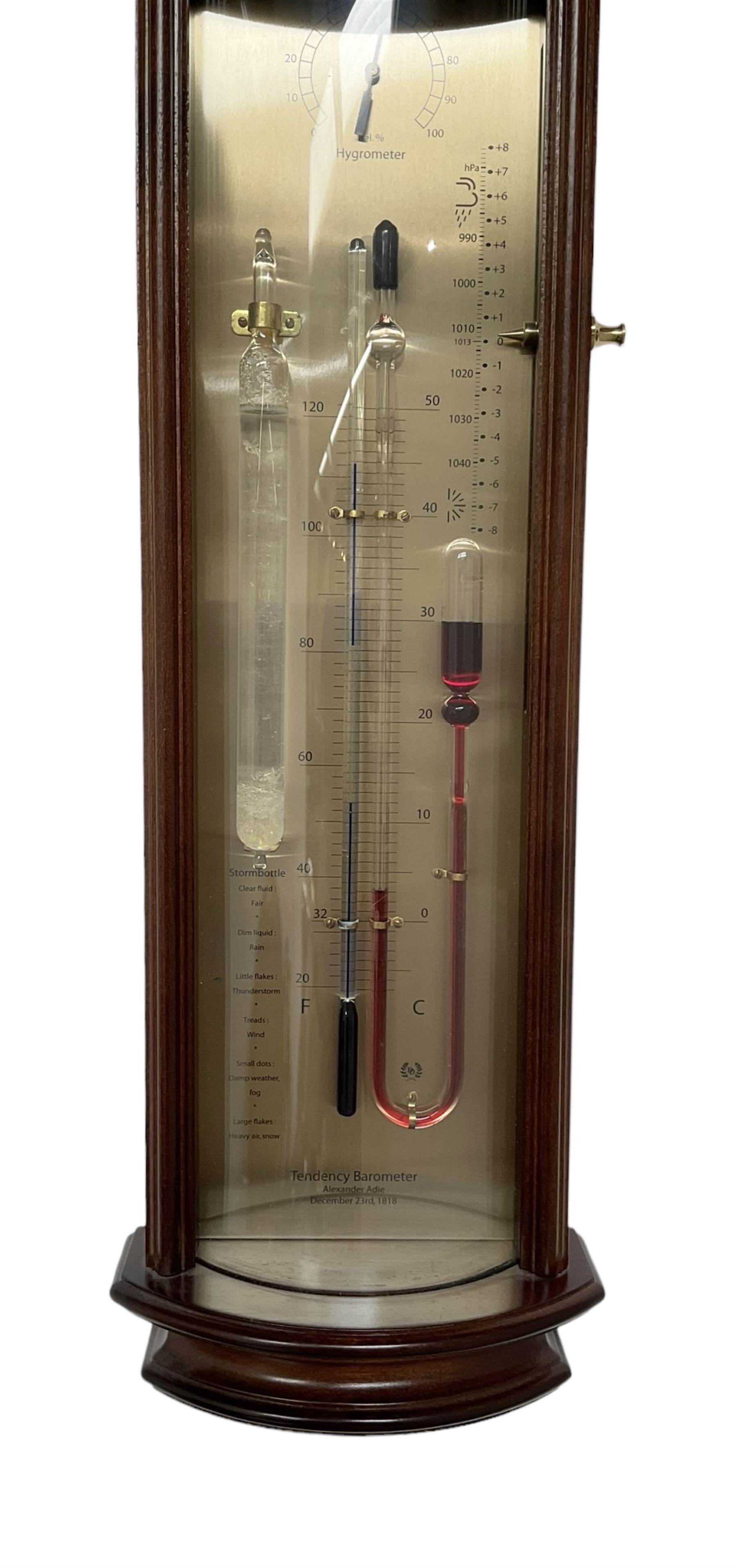 20th century Tendency Barometer -  to the design of Alexander Adie the 19th century inventor of the Sympiesometer, in a mahogany convex case with astragal moulding to the top and base, with an engraved silvered register, spirit thermometer, comparison Sympiesometer bulb and storm glass, adjustable vernier and hygrometer.
