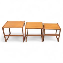 G-Plan - mid 20th century nest of three teak tables, rectangular tops with rounded edges, supported by sculptural open sided frames