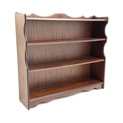 Rossmore Furniture - mahogany bookcase fitted with four shelves, shaped end supports