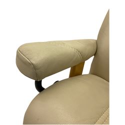 Ekornes - Stressless armchair upholstered in cream leather with matching footstool 