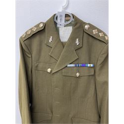 RAF Flight Lieutenant's uniform with peaked cap and WW2 ribbon bar; WW2 gas mask in blue canvas bag dated 1942; flying helmet date 1984; and British Army Major's uniform with Staybrite buttons and peaked cap