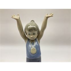 Lladro Olympic figures set, comprising Olympic Torch no 5870, Olympic Champion no 5871 and Olympic Pride no 5872, all with original boxes, largest example H25cm 