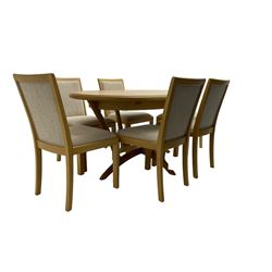 Contemporary light oak oval extending dining table, shaped X-frame base (W160cm D102cm); and set of six light oak dining chairs, back and seat upholstered in textured pebble cream fabric (W50cm H90cm)