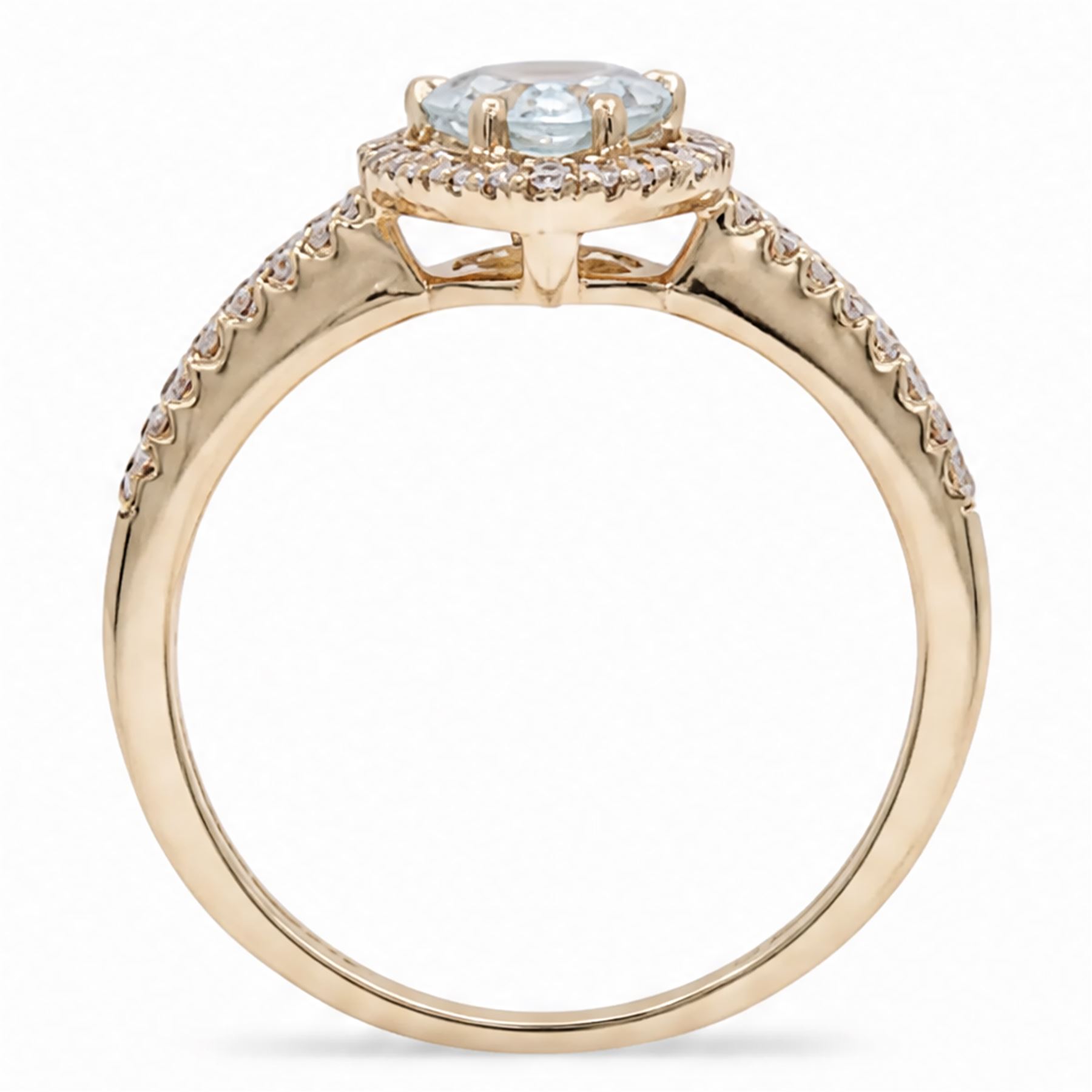 18ct gold aquamarine and diamond cluster ring, single pear cut aquamarine of approx 0.80 carat, surrounded by round brilliant cut diamonds and diamond set shoulders, London 2015