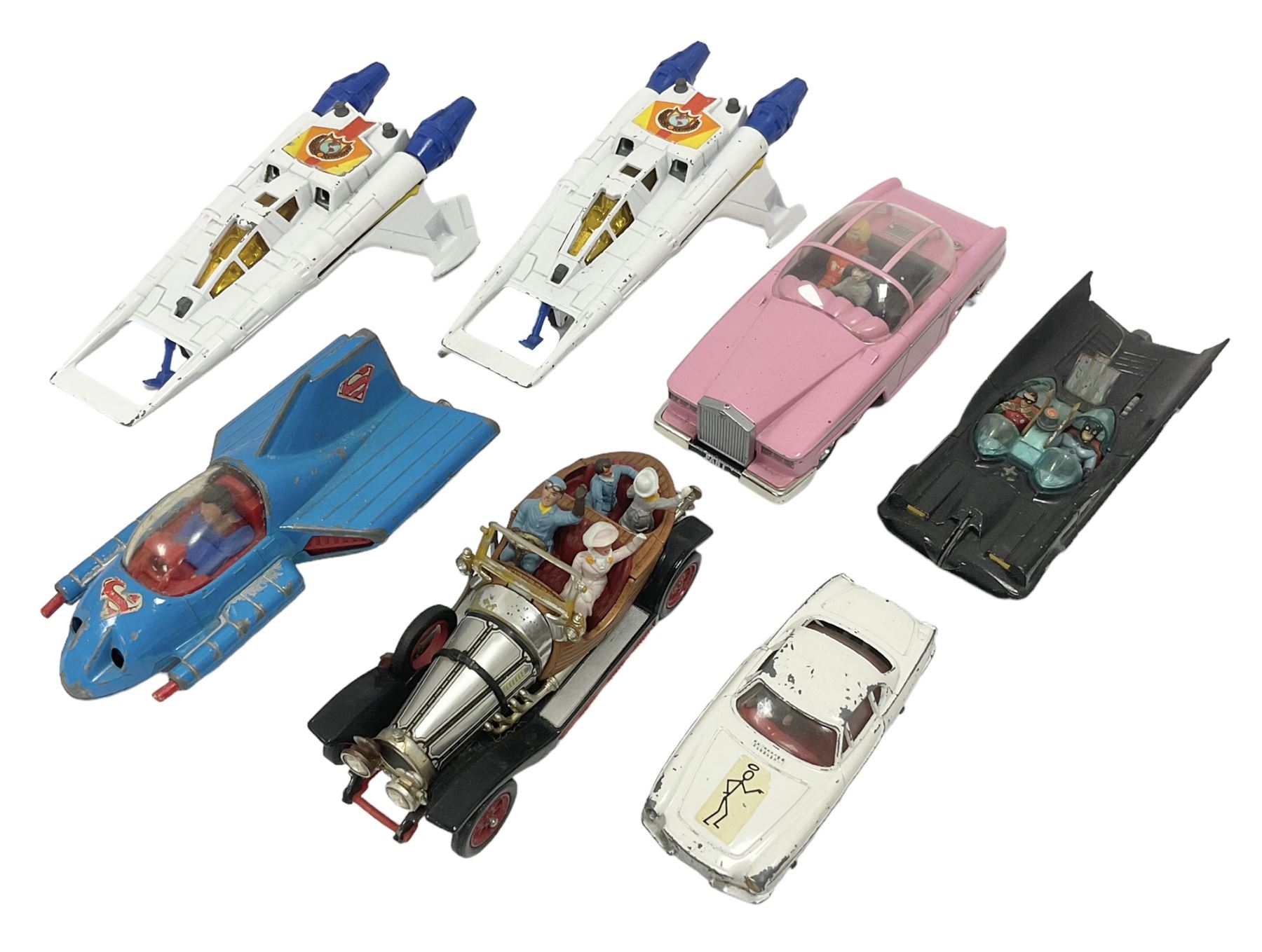 Corgi - seven unboxed and playworn TV/Film related die-cast models including Chitty Chitty Bang Bang with all four figures, Batmobile with both figures, Lady Penelope's FAB 1 with both figures, Superman Supermobile, two Buck Rogers Starfighters and The Saint's Volvo P.1800 (7)