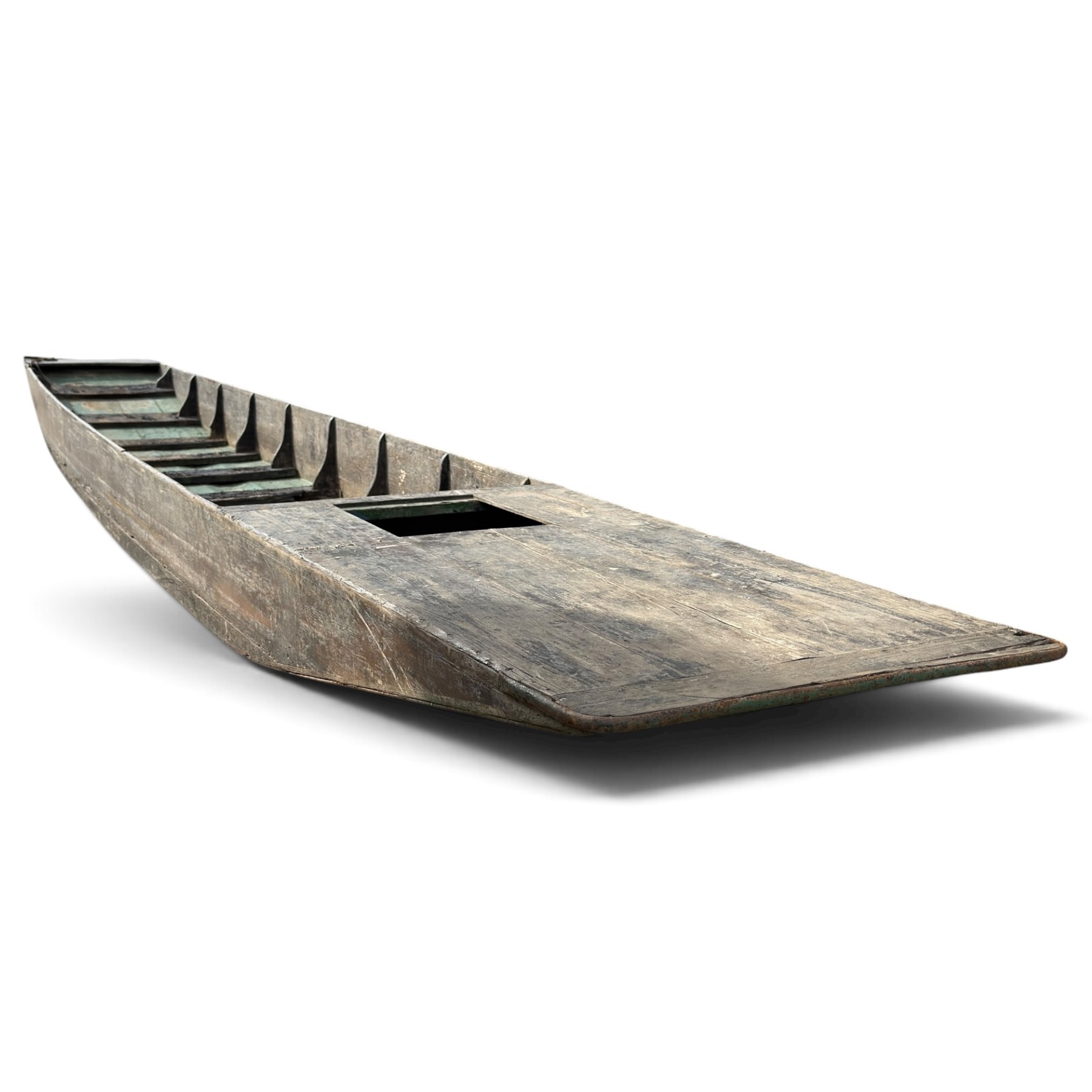 Large early 20th century plank-built wooden river punt, the long tapering hull with enclosed fore and aft decks, open green-painted ribbed interior, together with two paddles