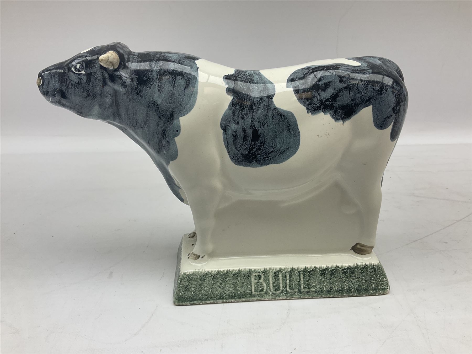 Six Rye Pottery figures, comprising, jumping fox, squirrel upon a branch, billy goat, bull, chicken and cockerel  